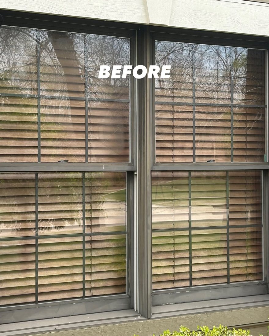 Centerville home before window replacement, with old bronze double-hungs