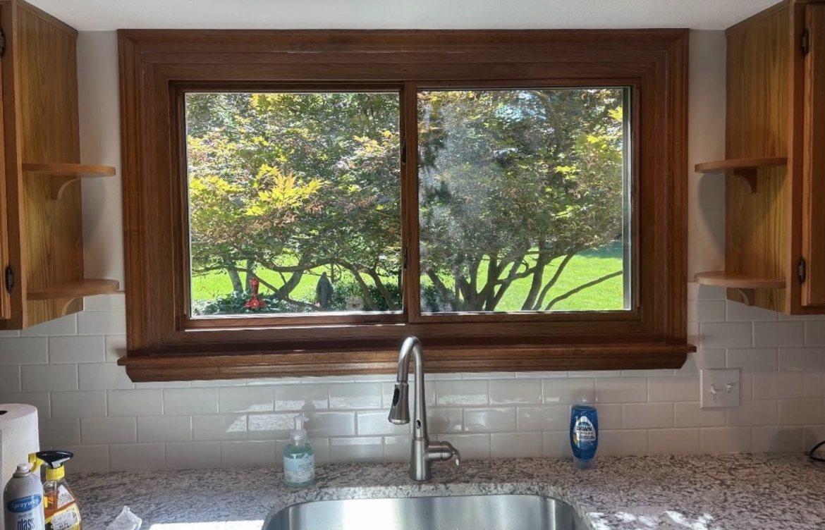 New kitchen window installed by Southwest Home Services in Fairborn, with wood interior trim