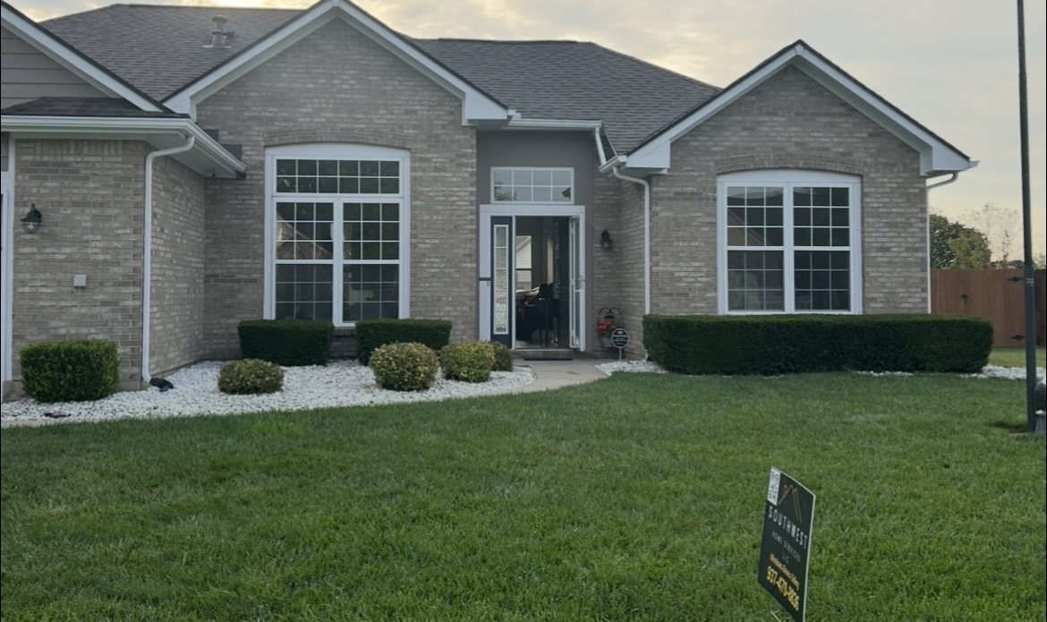 Fairborn brick home before window replacement, with old gridded windows